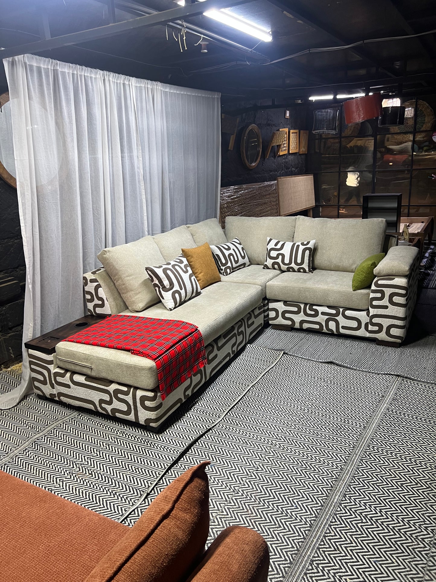 Cream and casa L-shape sofa for ksh 160,000 with 50 D cushions