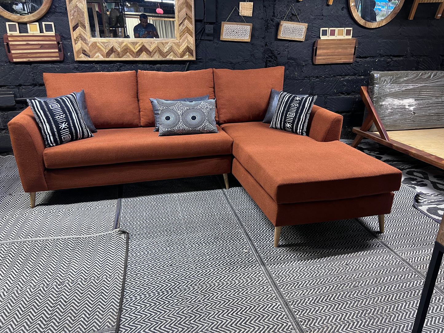 Burnt orange L-shape sofa for ksh 90,000 with 40D cushions