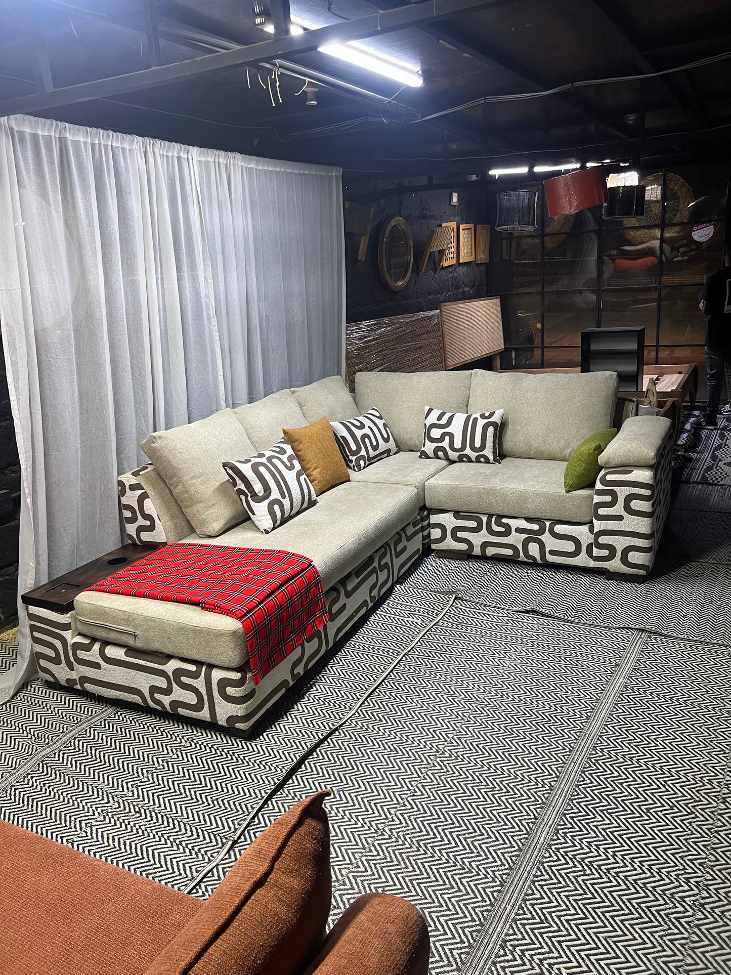 Cream and casa L-shape sofa for ksh 160,000 with 50 D cushions