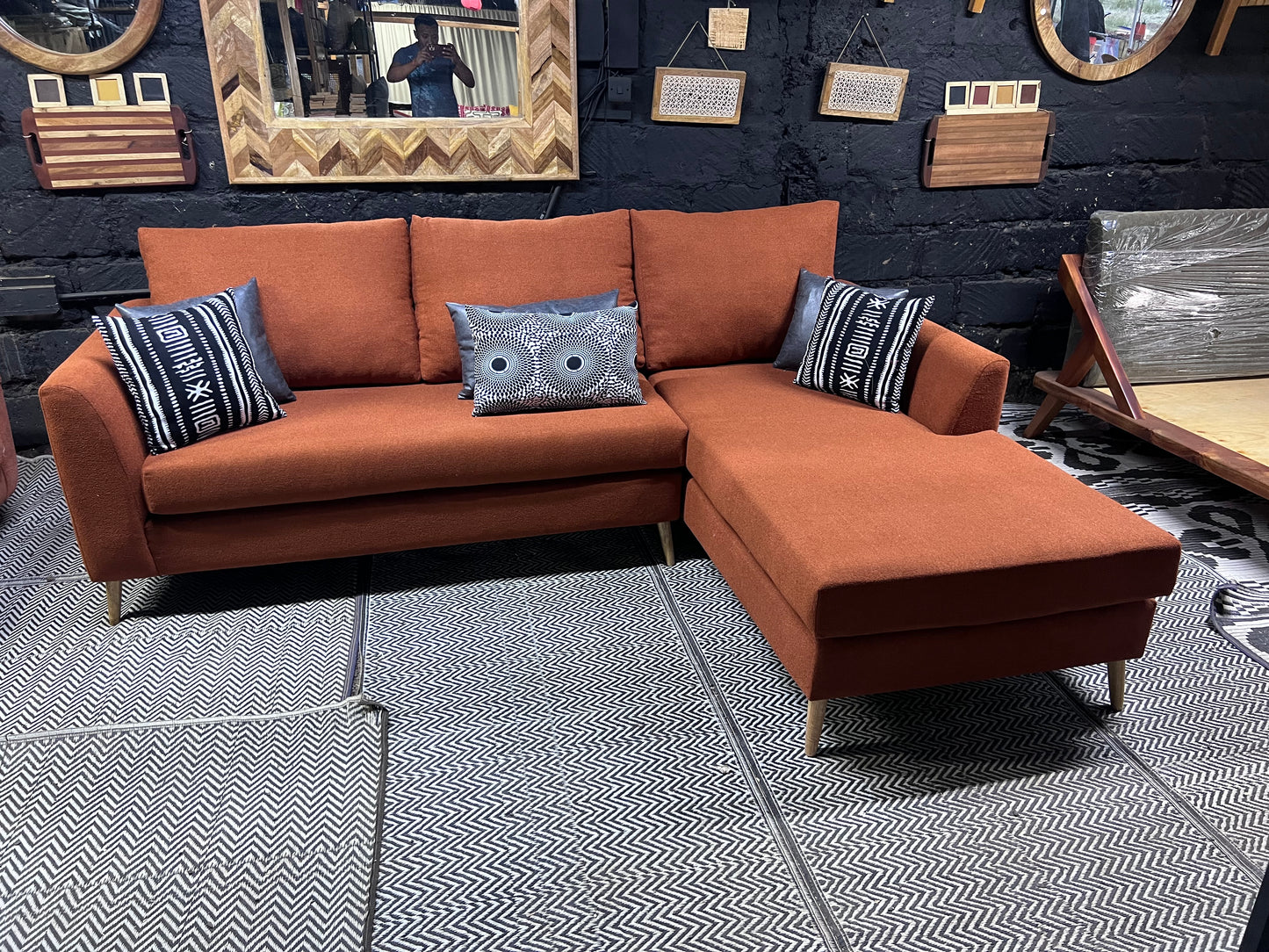Burnt orange L-shape sofa for ksh 90,000 with 40D cushions