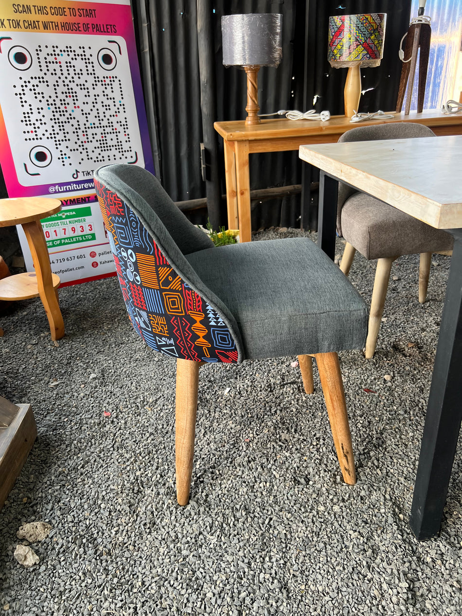 A Classic Upholstered dining chairs with Kitenge at the back in Nairobi Kenya