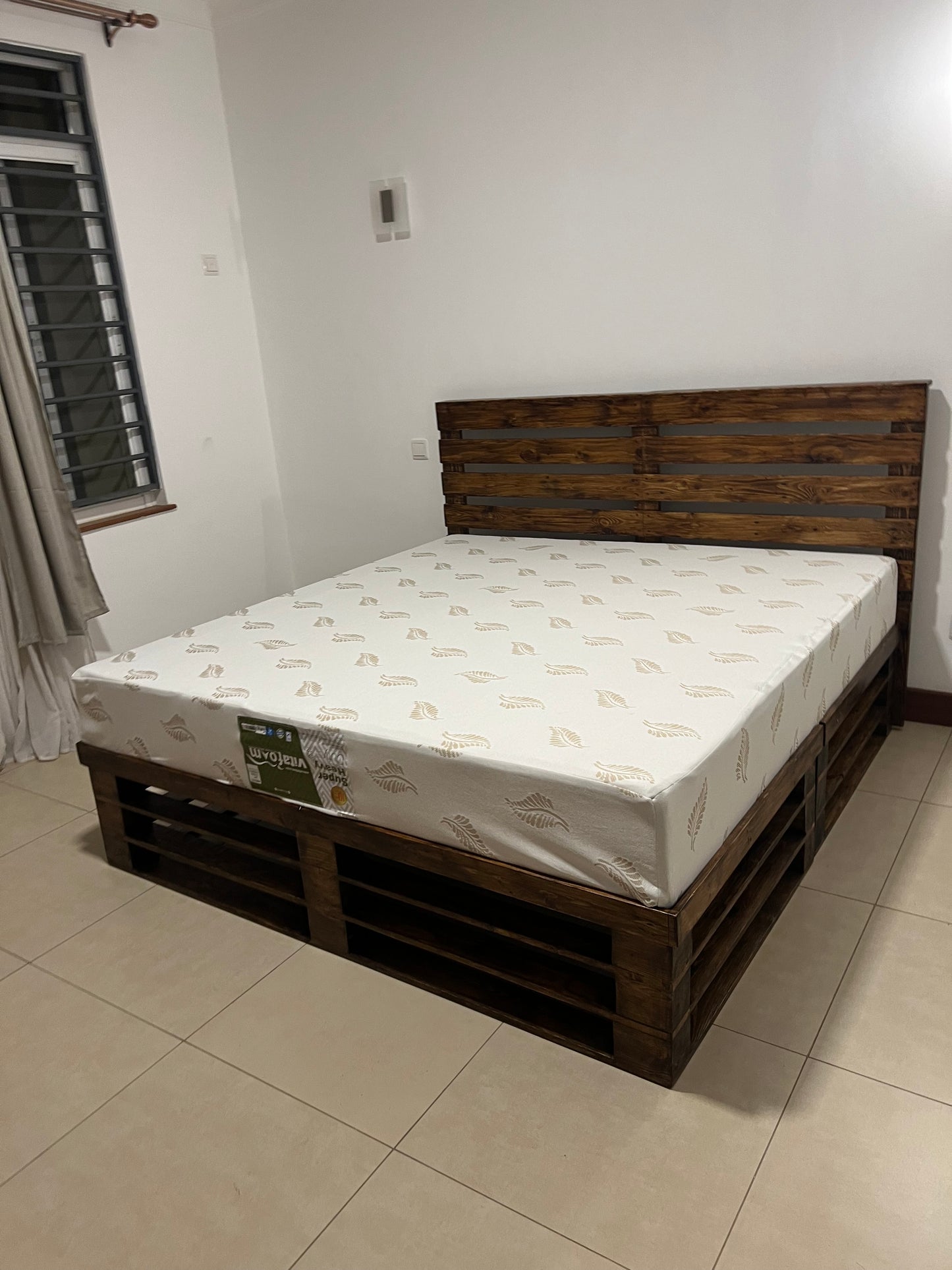 Dark oak stained pallet bed