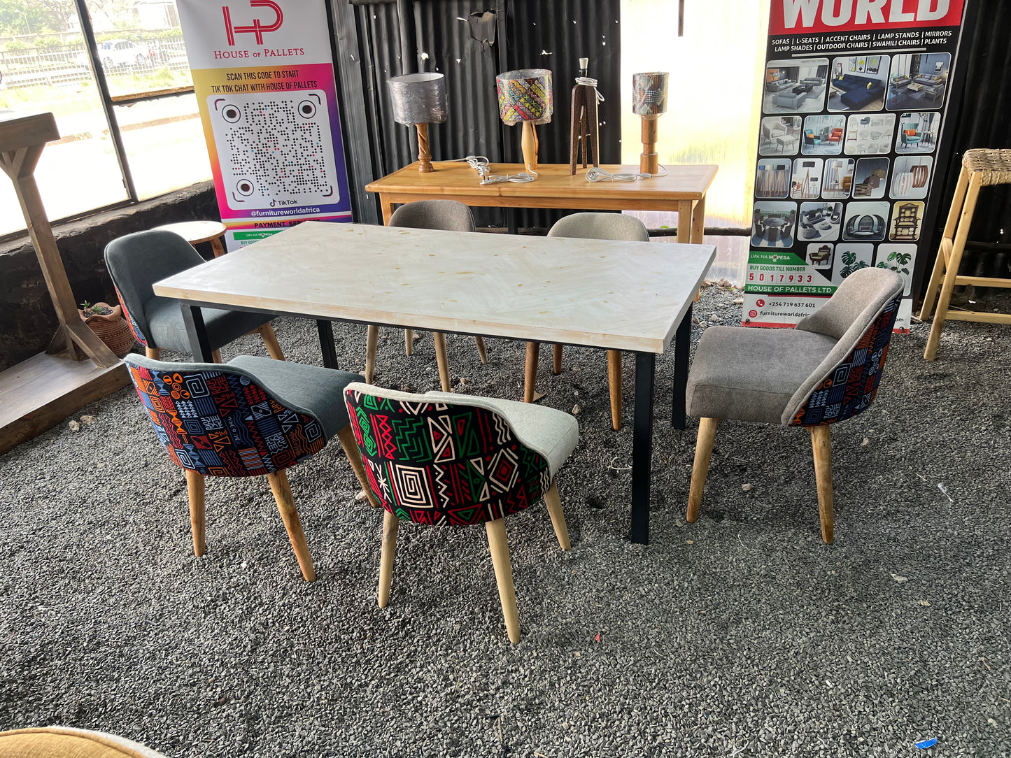 Dining set made of pine wood and kitenge fabric chairs