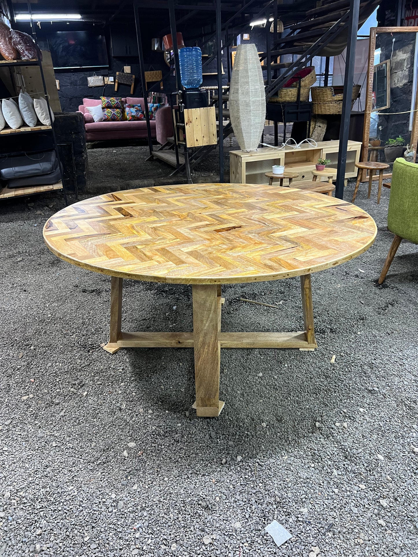 Round Mango wood herringbone pattern dining table