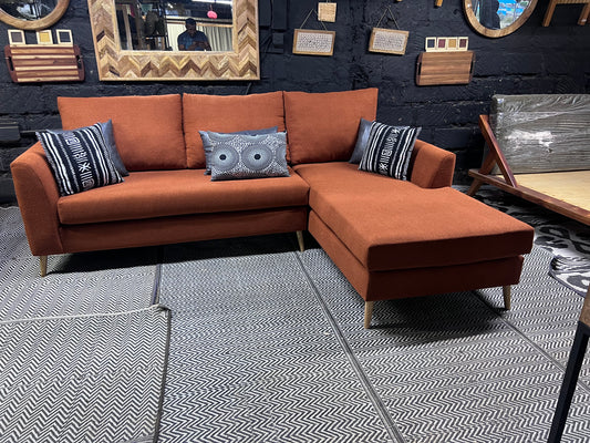 Burnt orange L-shape sofa for ksh 90,000 with 40D cushions