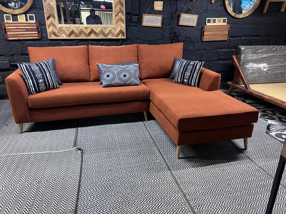 Burnt orange L-shape sofa for ksh 90,000 with 40D cushions