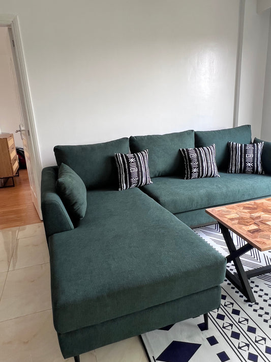 Green L-shape sofa for ksh 90,000  with 40 D cushions