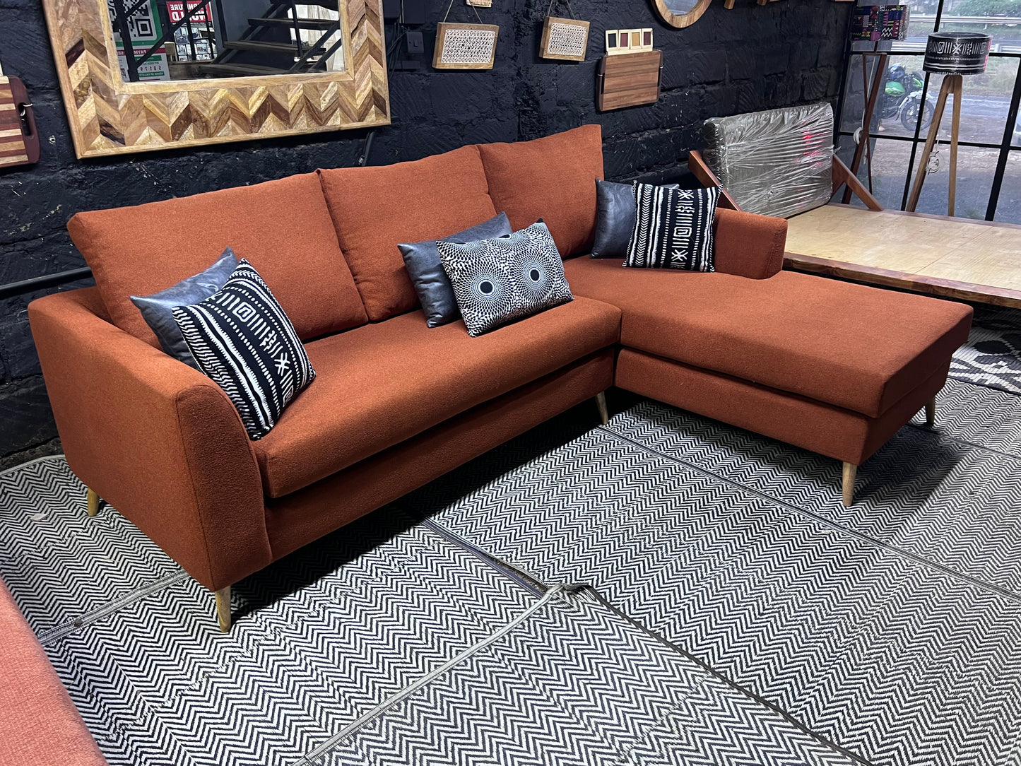 Burnt orange L-shape sofa for ksh 90,000 with 40D cushions