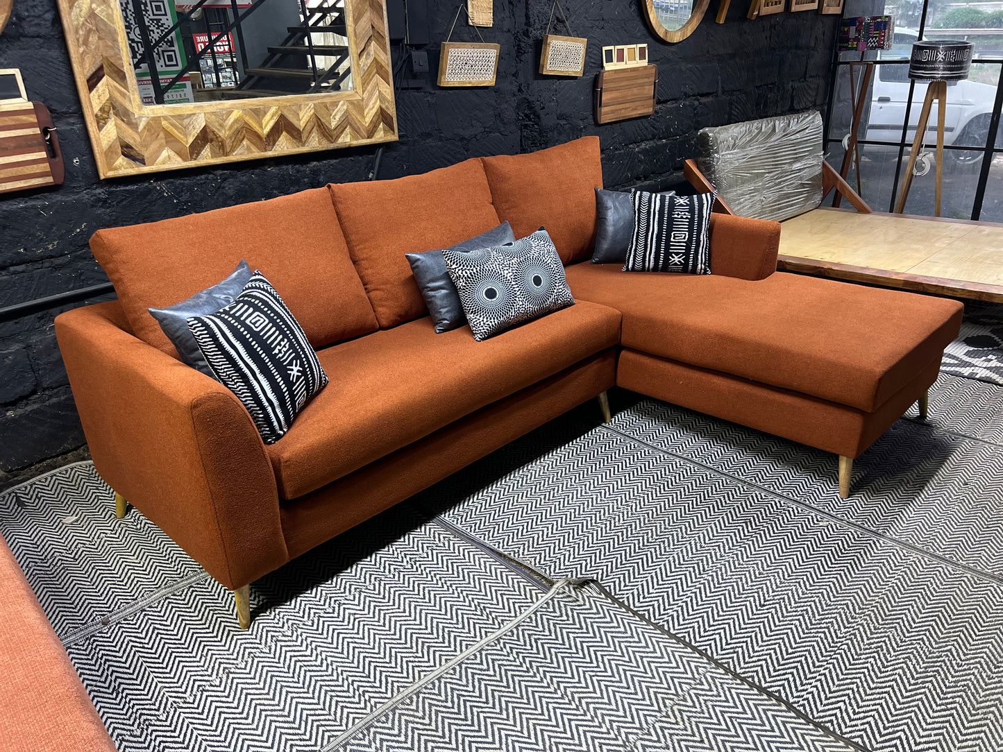 Burnt orange L-shape sofa for ksh 90,000 with 40D cushions
