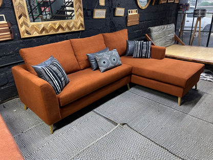 Burnt orange L-shape sofa for ksh 90,000 with 40D cushions