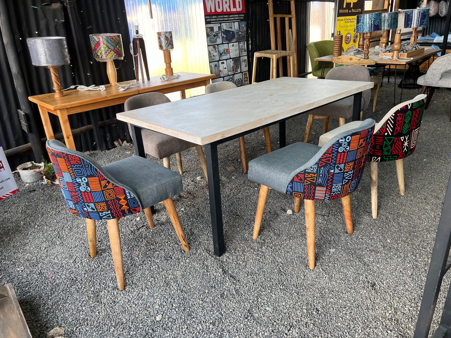 Dining set made of pine wood and kitenge fabric chairs