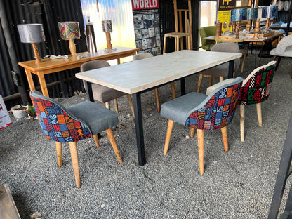 Dining set made of pine wood and kitenge fabric chairs