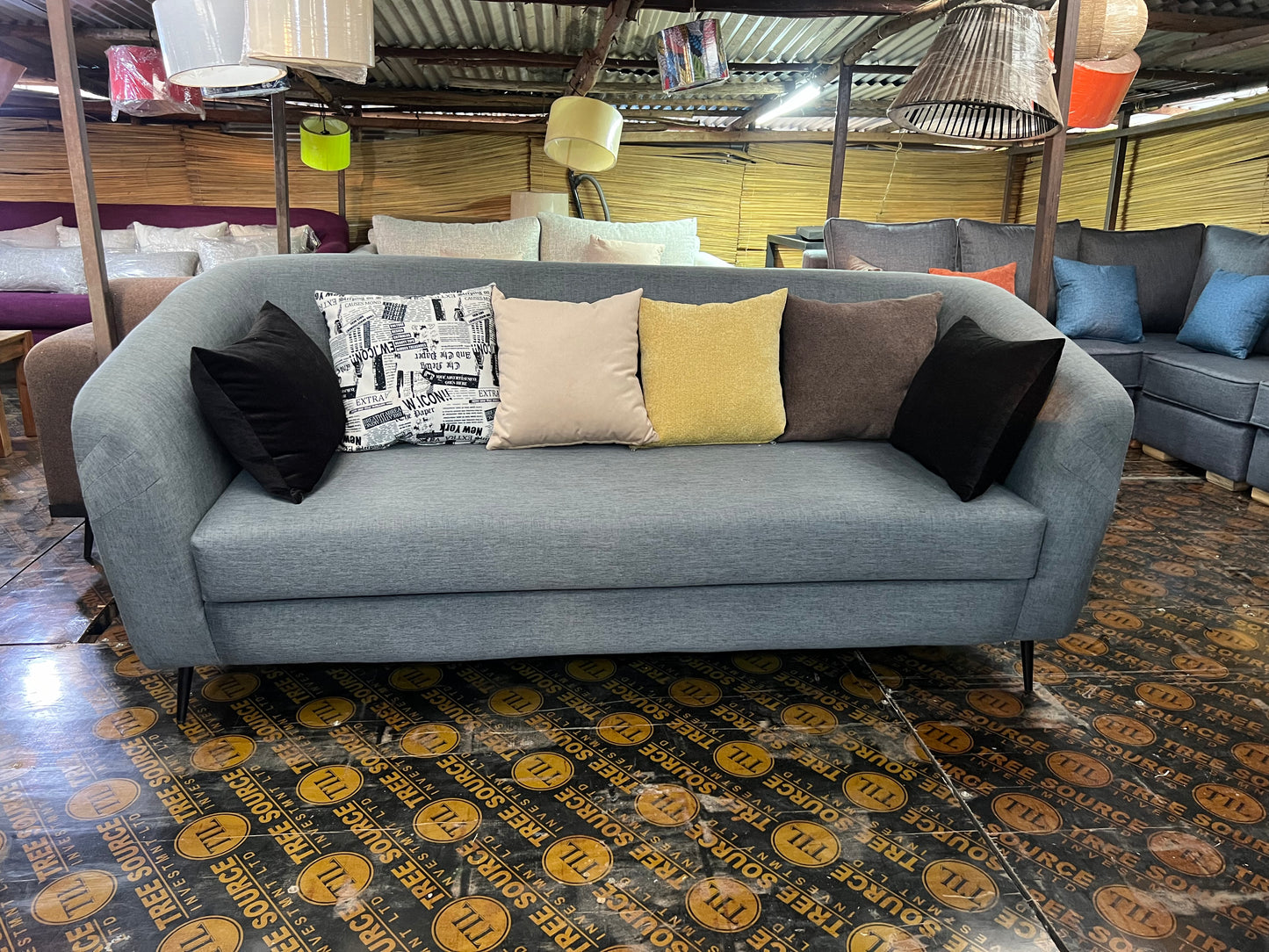 Grey 3 seater sofa with throw pillows