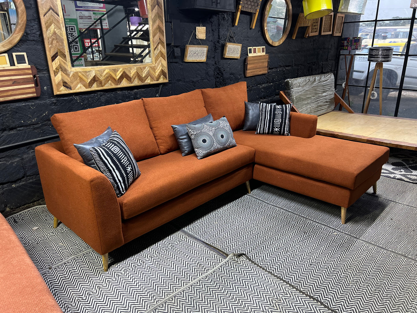 Burnt orange L-shape sofa for ksh 90,000 with 40D cushions