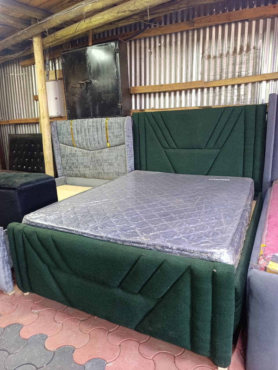 Green fabric chester bed