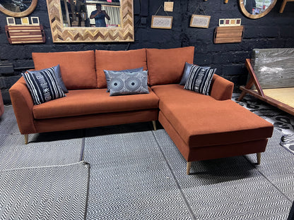 Burnt orange L-shape sofa for ksh 90,000 with 40D cushions
