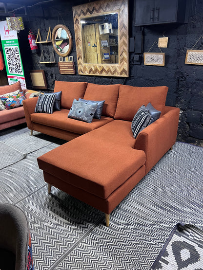 Burnt orange L-shape sofa for ksh 90,000 with 40D cushions