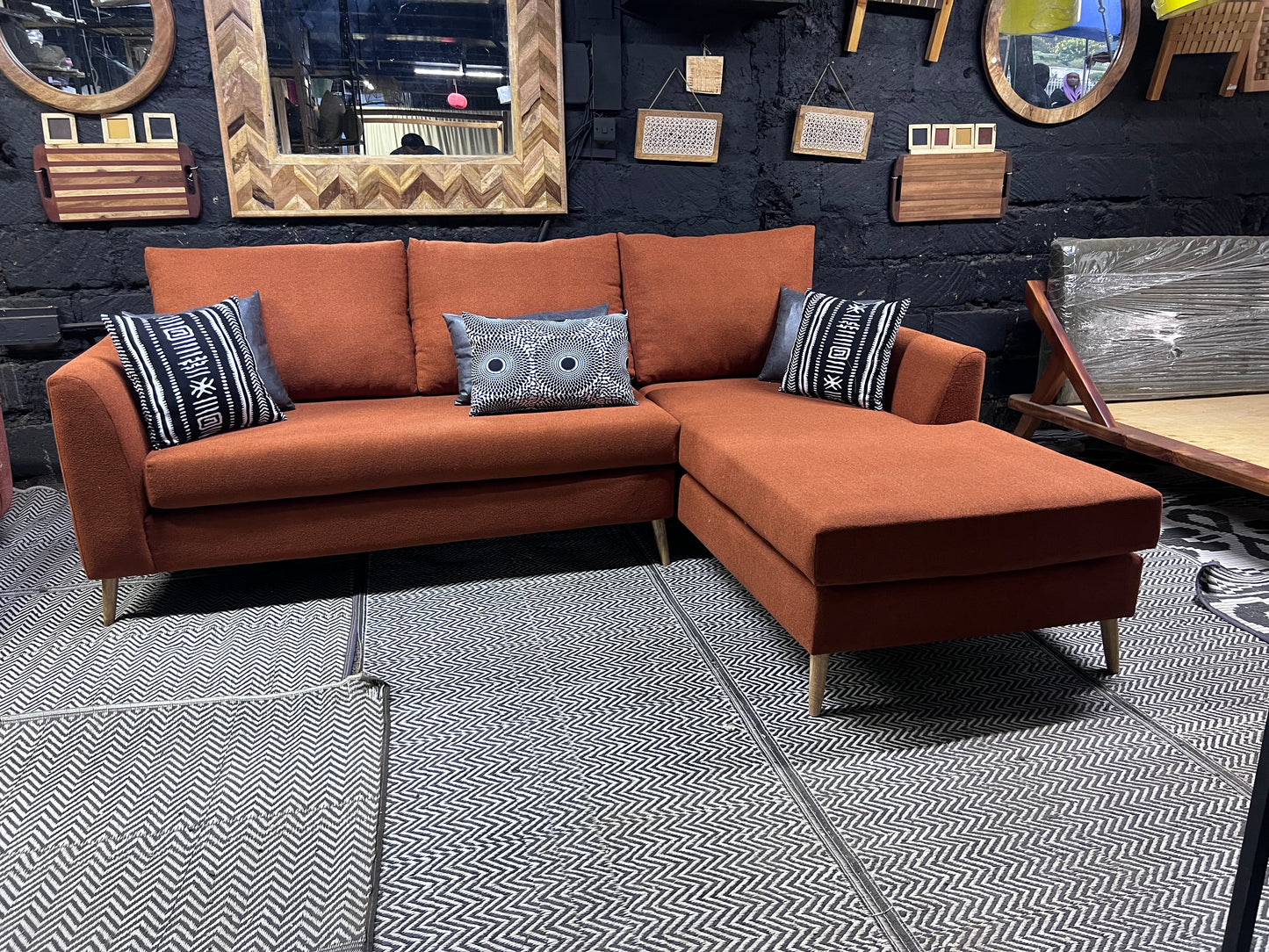 Burnt orange L-shape sofa for ksh 90,000 with 40D cushions