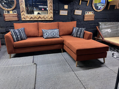 Burnt orange L-shape sofa for ksh 90,000 with 40D cushions