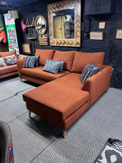 Burnt orange L-shape sofa for ksh 90,000 with 40D cushions
